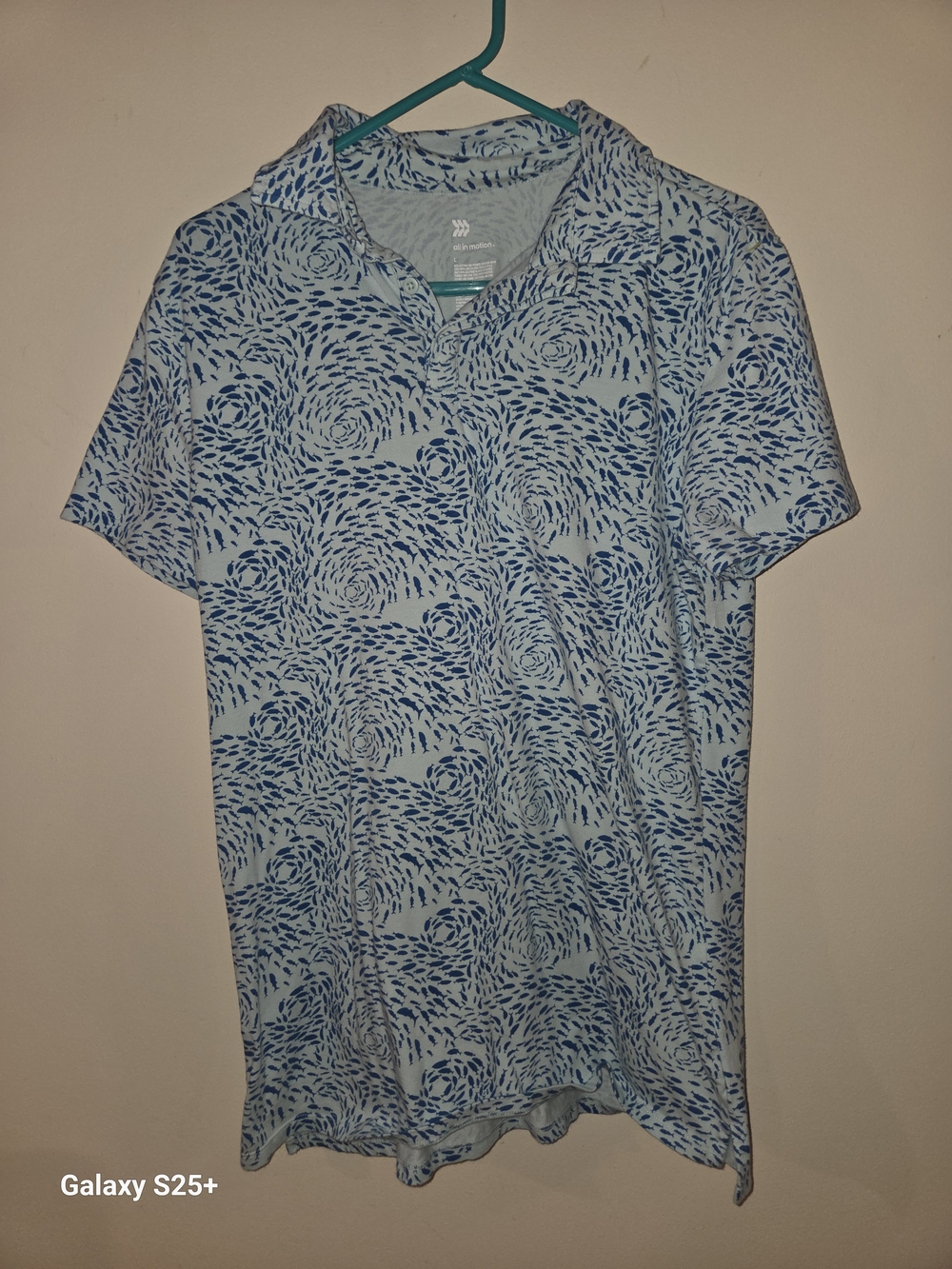 all in motion Light Blue Polo with Navy Swirl Pattern